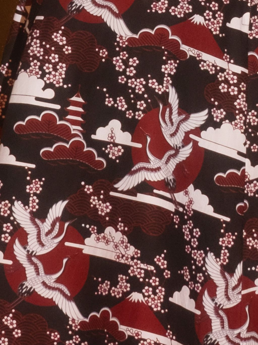 close up of claret crane print fabric