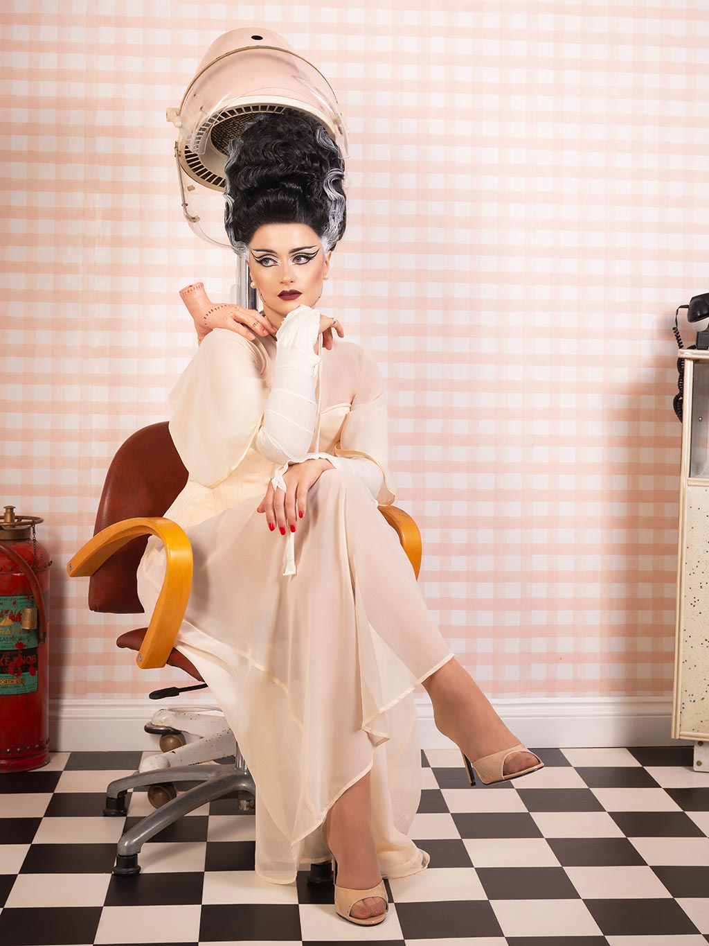 Model wearing peach full-length sheer robe with butterfly sleeves