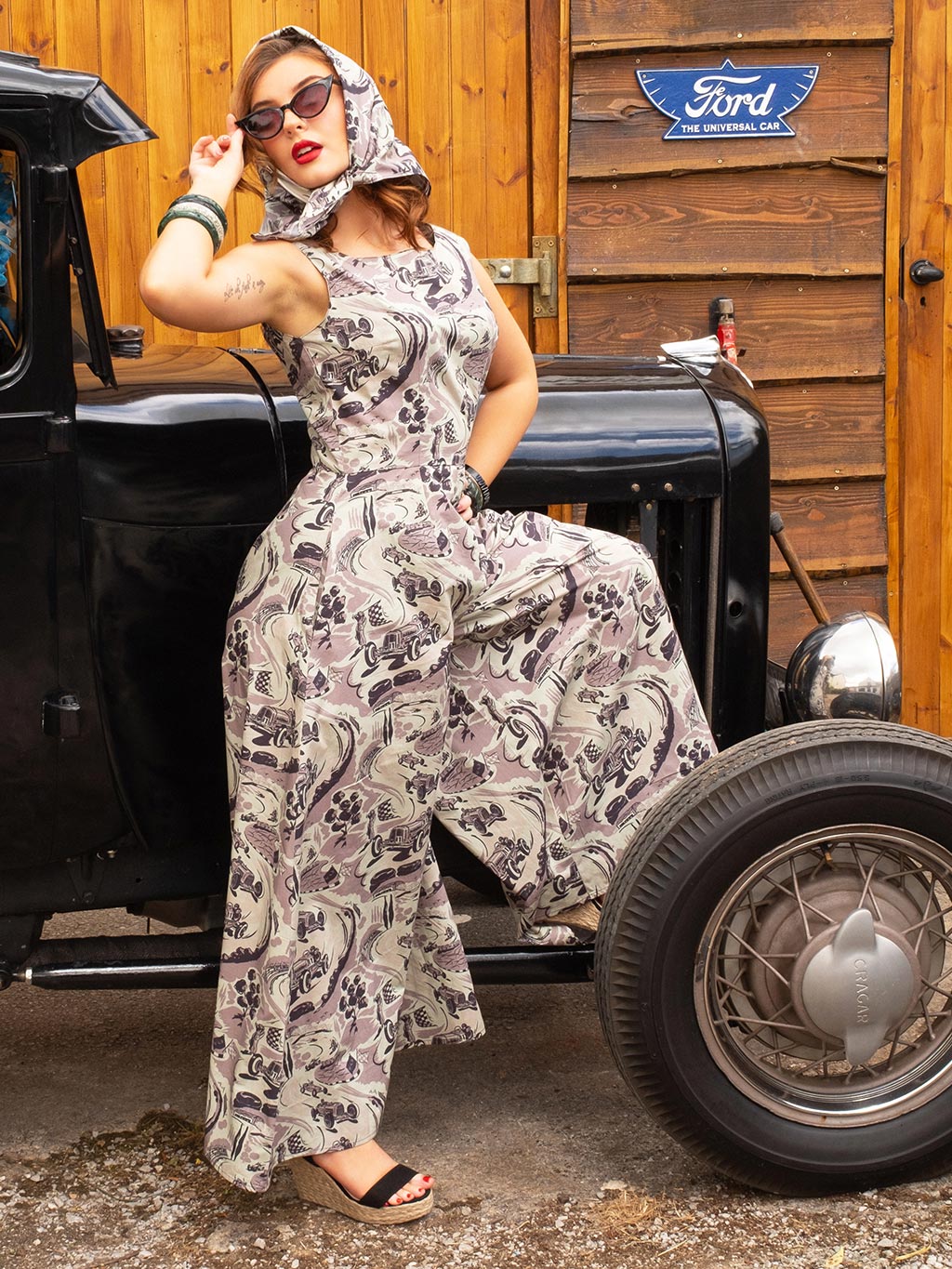 Woman in Remus Racetrack jumpsuit showcasing high neck and wide shoulders