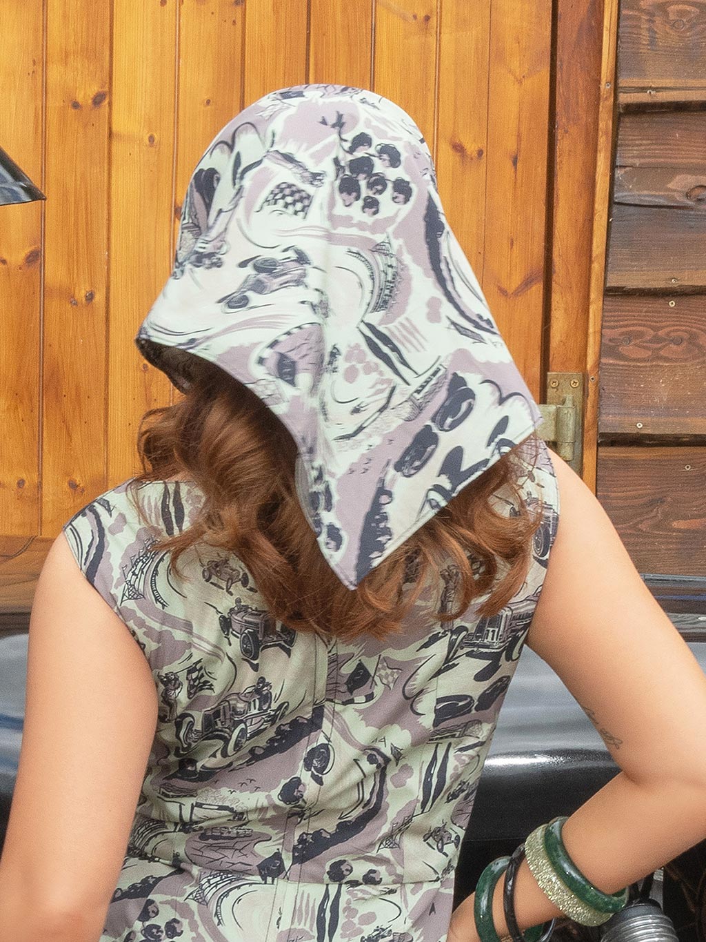 Back view of vintage motor racing print head scarf