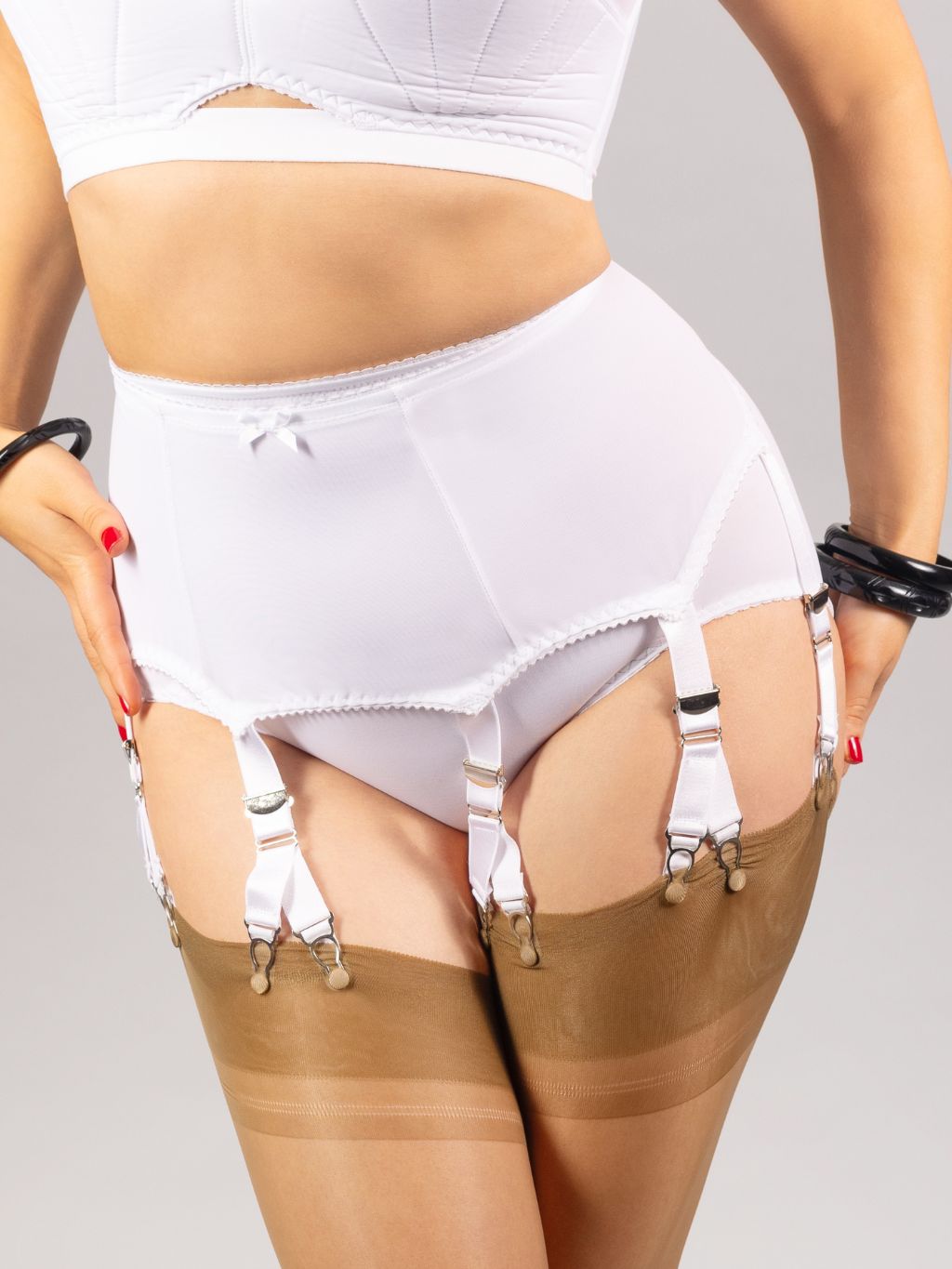 white V-clip suspender belt styled with stockings