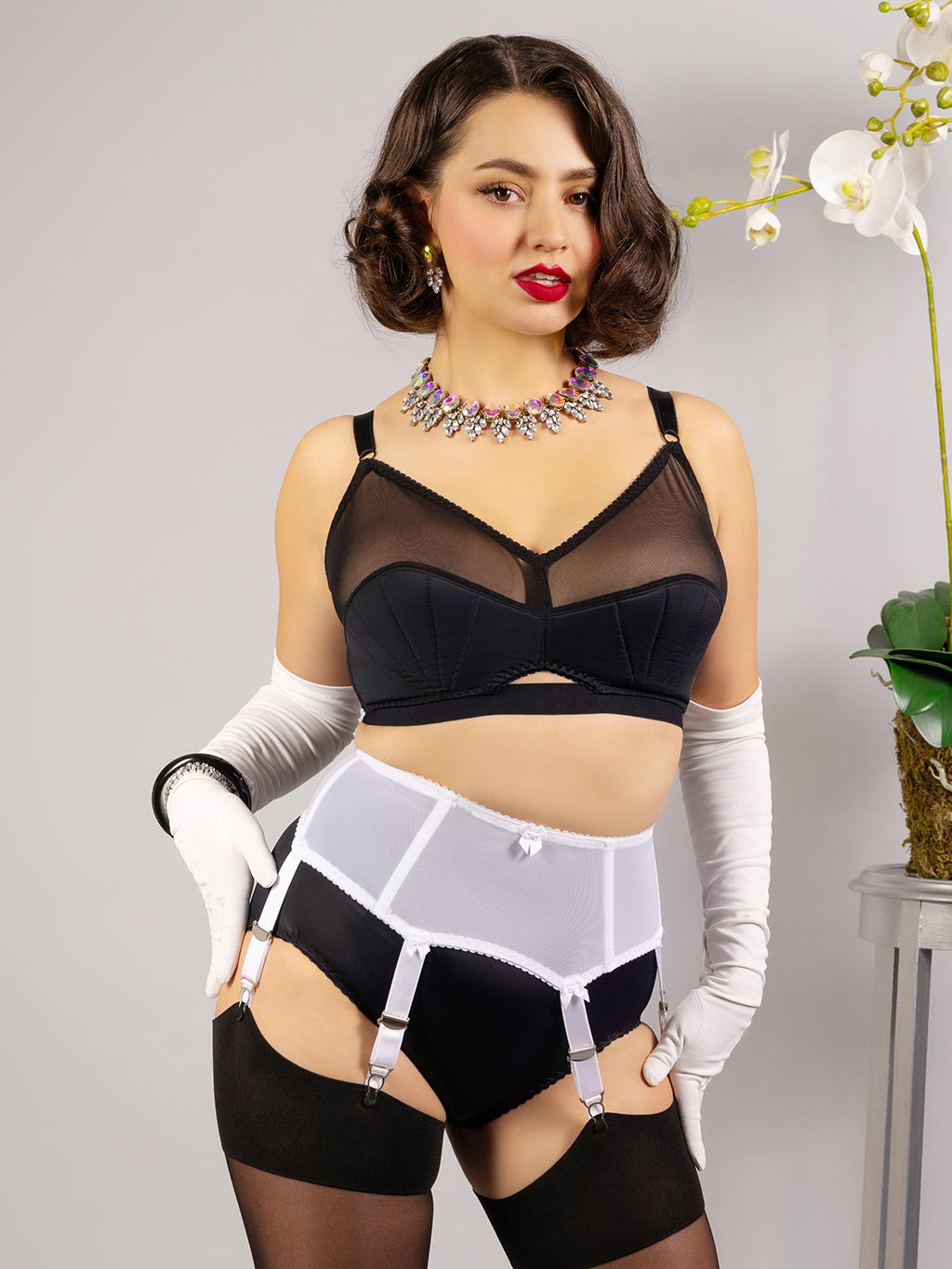 white boned garter belt worn with retro black lingerie