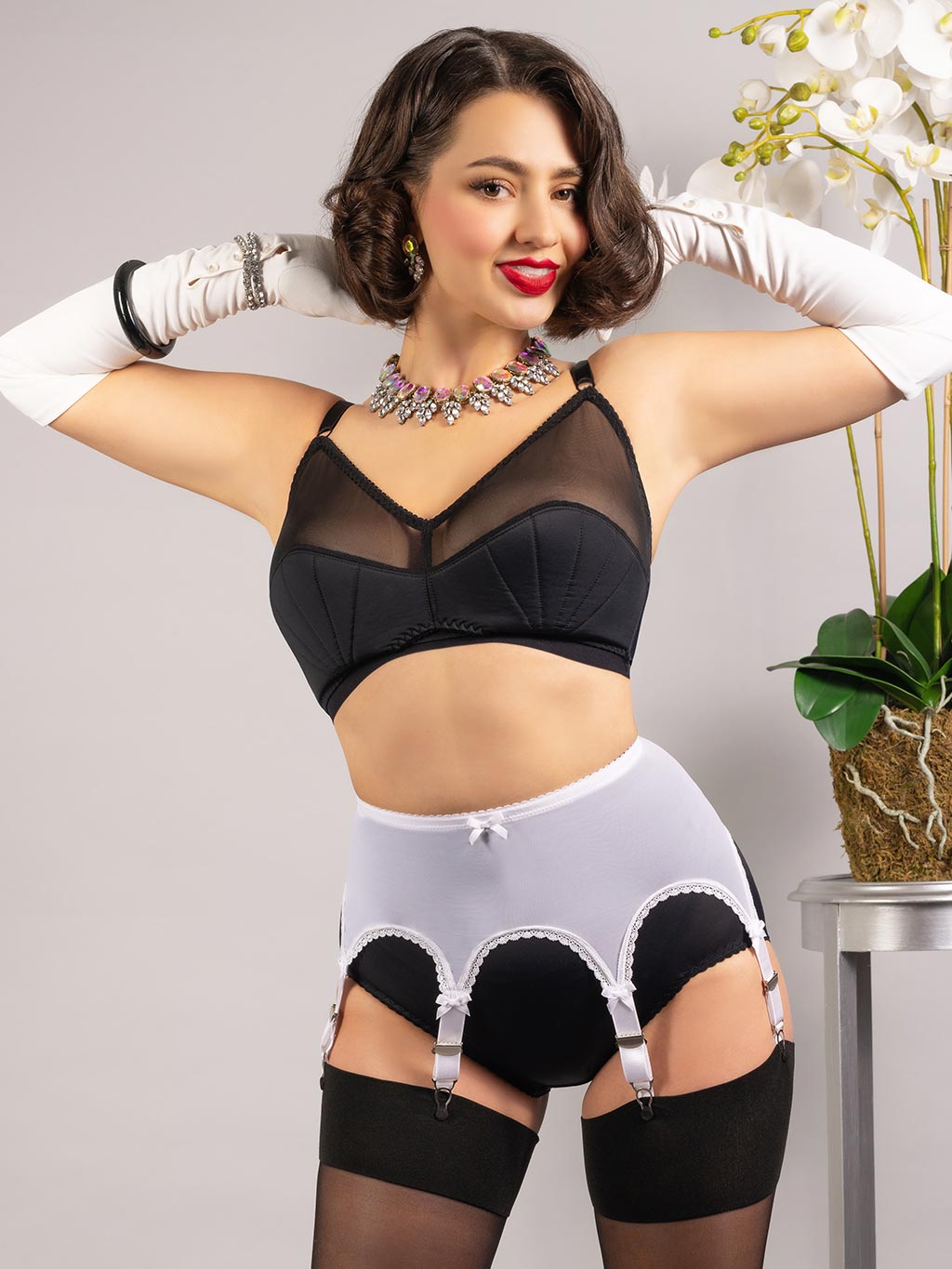 white pull on powermesh suspender belt worn with black lingerie and stockings